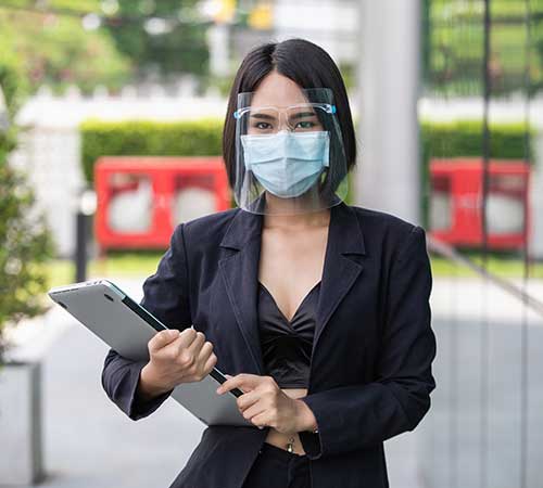 business woman wearing face shield