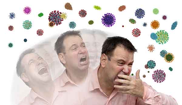 man sneezing spreading droplets
