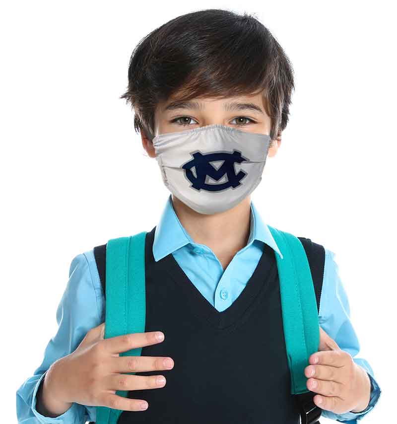 Boy wearing face mask with school logo